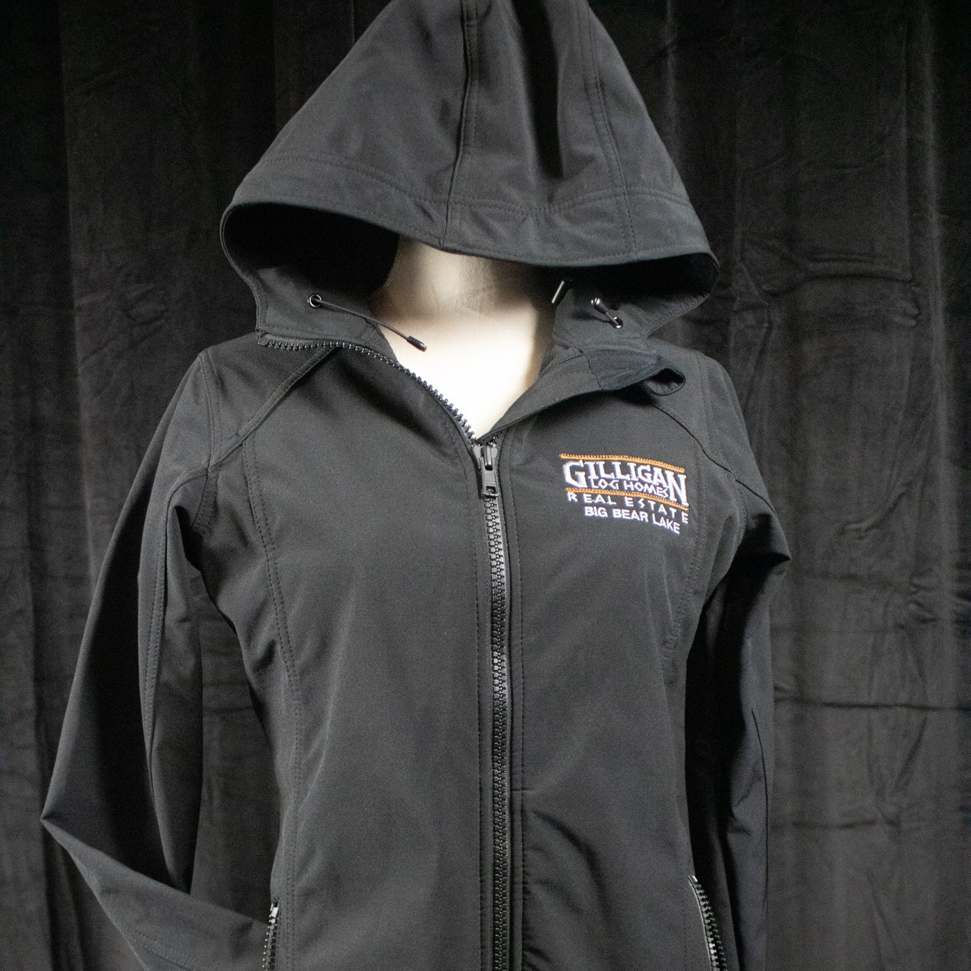 Port Authority Women's Black Active Hooded Rain Jacket with "Gilligan Log Homes Real Estate Big Bear Lake" logo