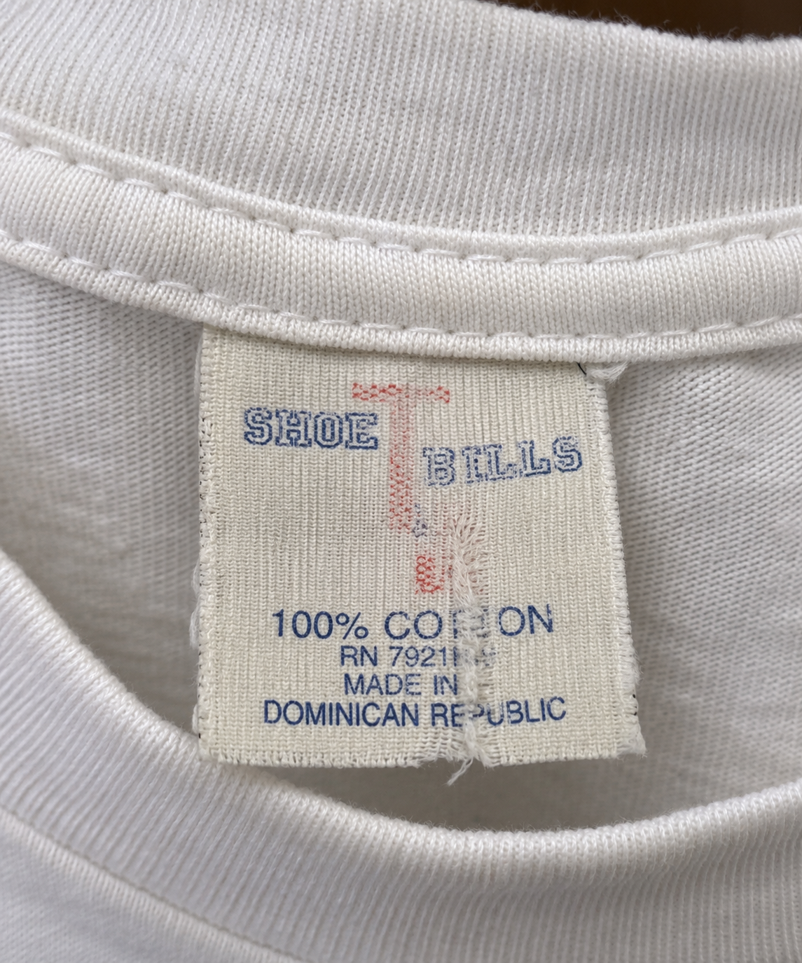 "Short Hill White Tee with Cowboy Boot Graphic"