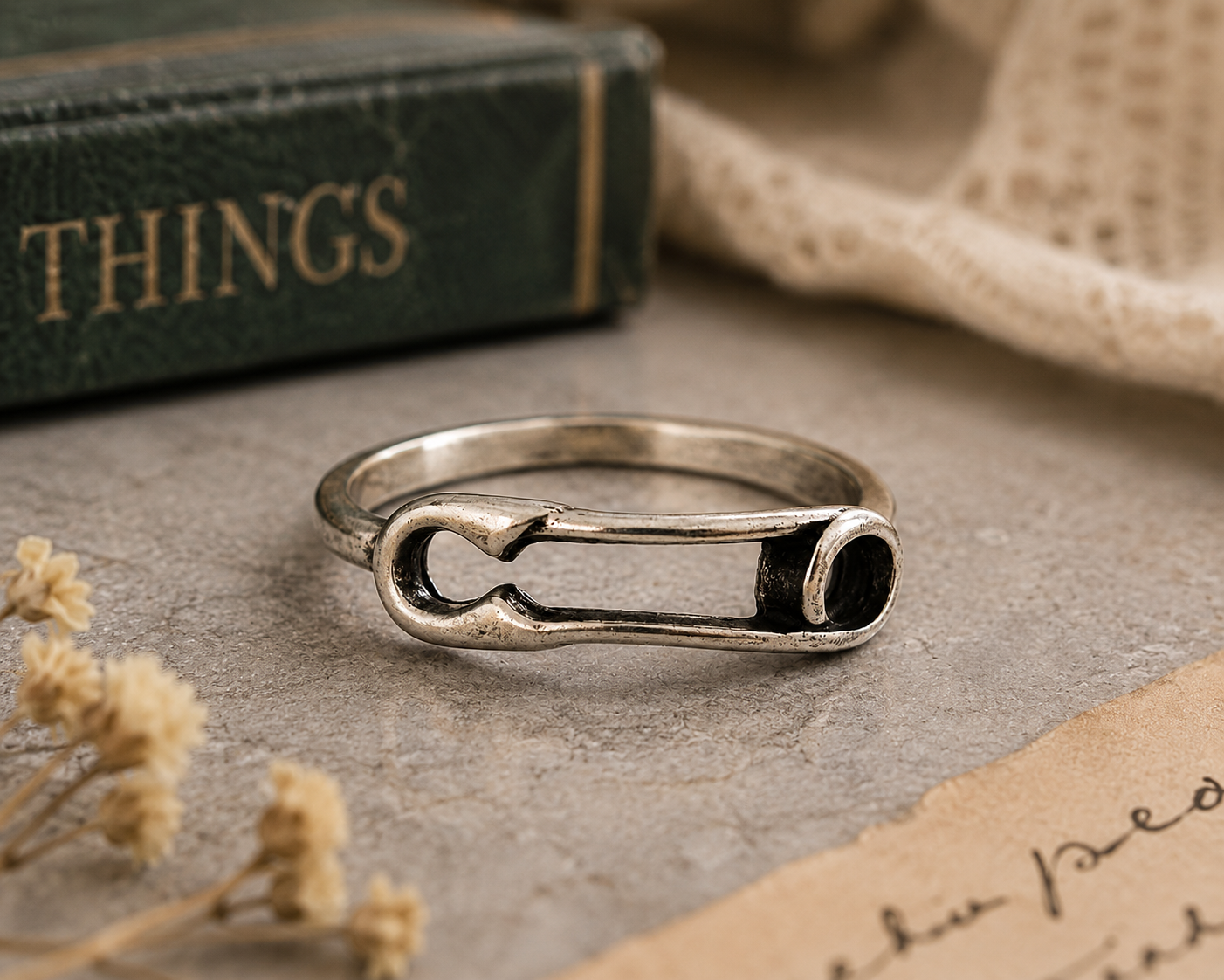 Silver-plated safety pin ring in size 6 featuring a minimalist contemporary design. Lightweight fashion jewelry perfect for everyday wear, stacking, and unique accessory styling.