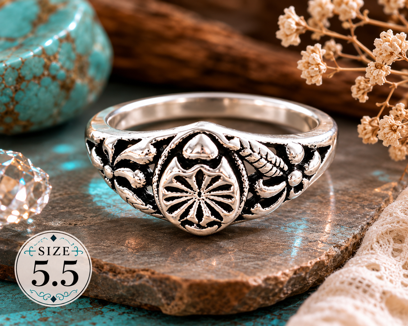 Vintage-style silver-plated ring featuring an ornate floral centerpiece with decorative scrollwork details, size 5.5, ideal for everyday wear and vintage-inspired fashion styling.