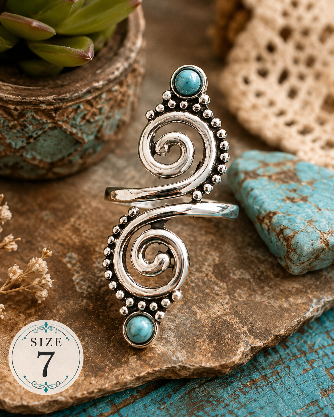 Bright silver-plated knuckle ring featuring decorative spiral scrollwork, faux turquoise accents, and beaded detailing, size 7, designed as a bold statement fashion accessory.