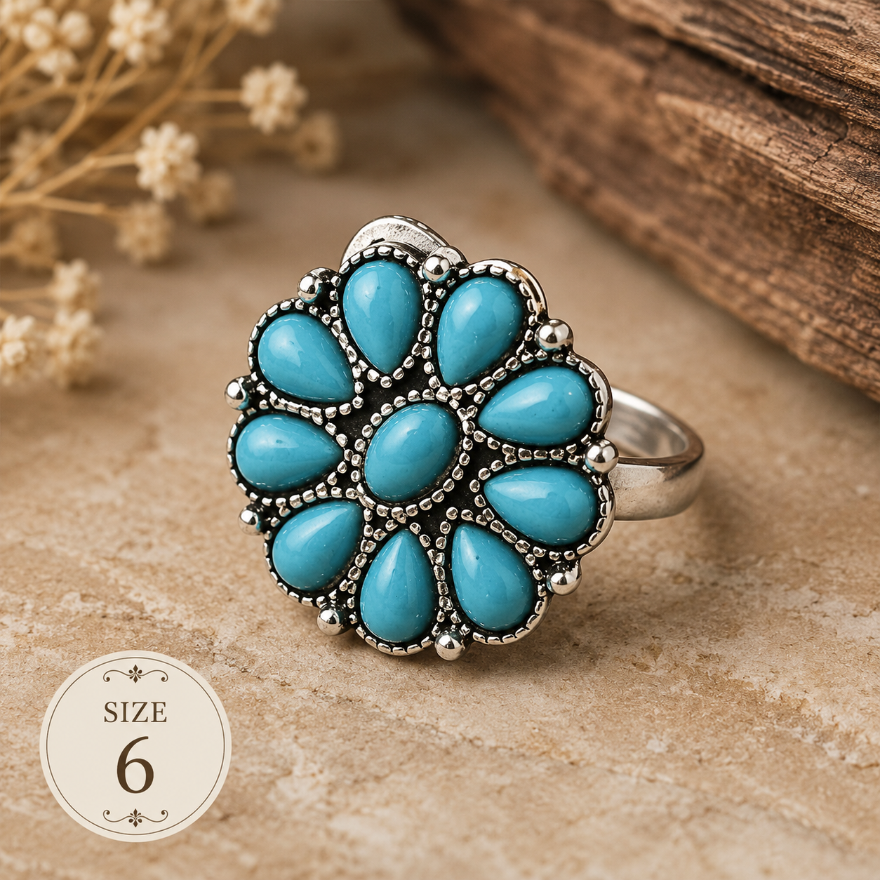 Silver-plated flower statement ring featuring nine faux turquoise stones arranged in a floral pattern with decorative beaded detailing, size 6, styled with Southwestern-inspired design elements.