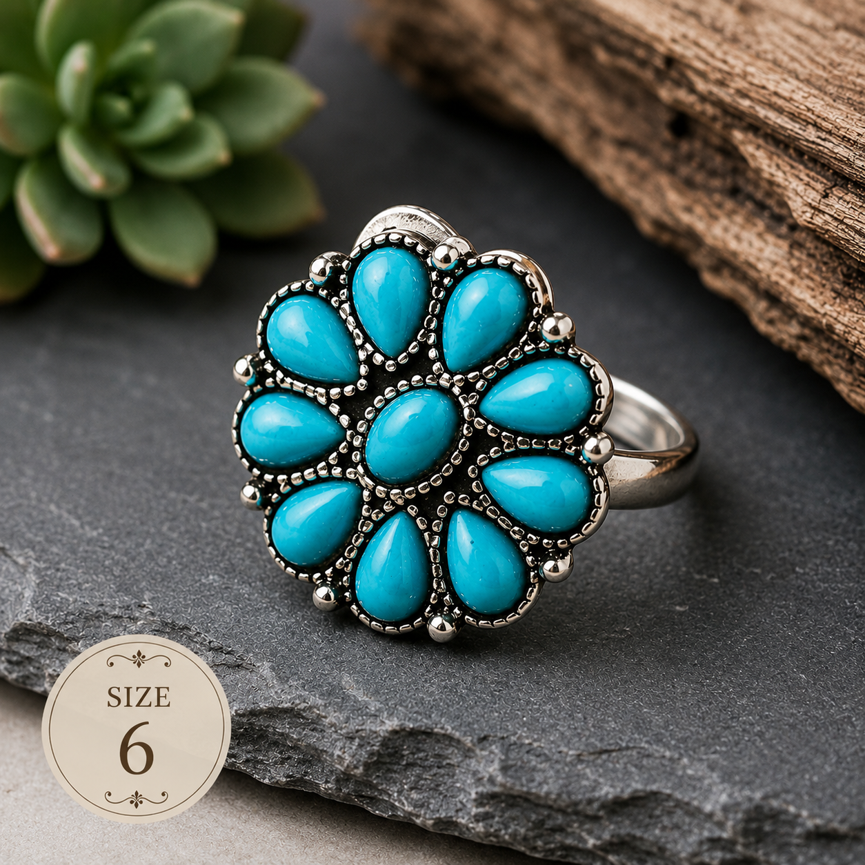 Silver-plated flower statement ring featuring nine faux turquoise stones arranged in a floral pattern with decorative beaded detailing, size 6, styled with Southwestern-inspired design elements.
