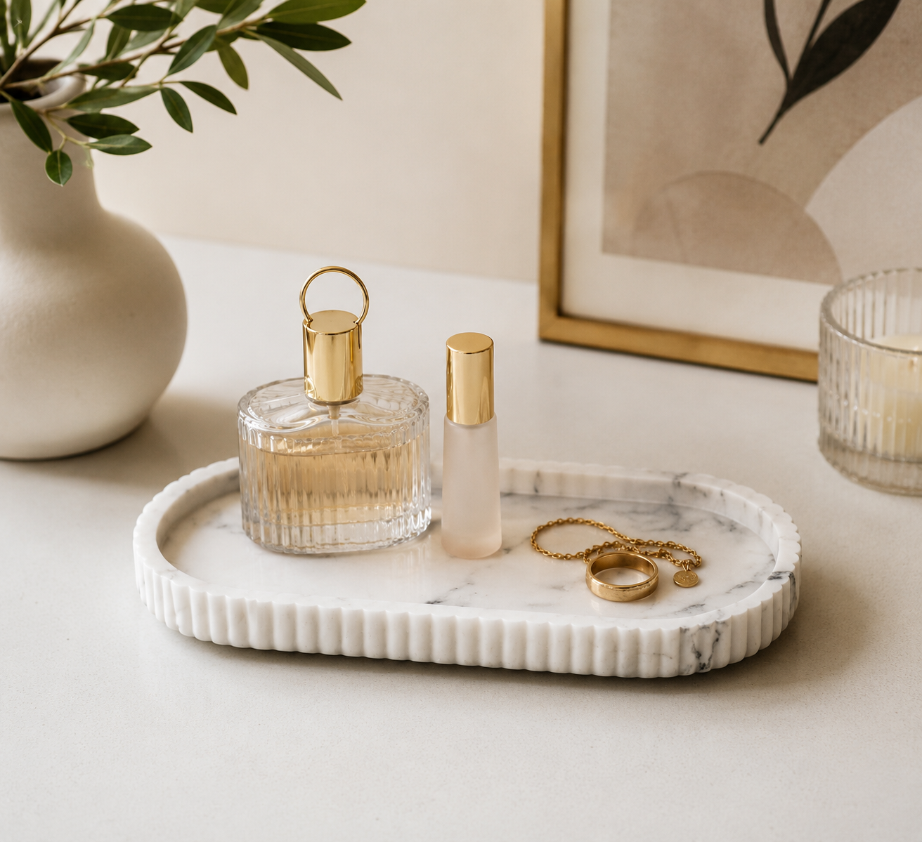 White marble decorative tray measuring 5 x 9 inches with gray veining and fluted edges, displayed on a dresser holding a vase and candle for elegant home organization.