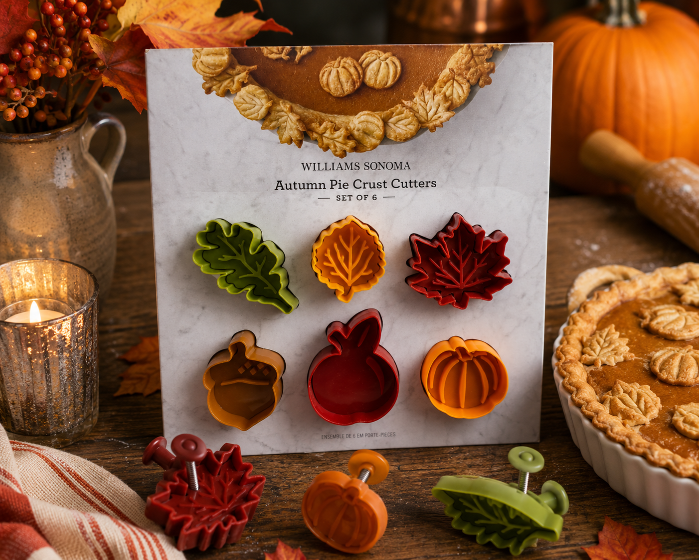 Williams Sonoma Autumn Pie Crust Cutters Set of 6 featuring pumpkin, apple, acorn, oak leaf, and maple leaf shapes for fall pie and cookie decorating.