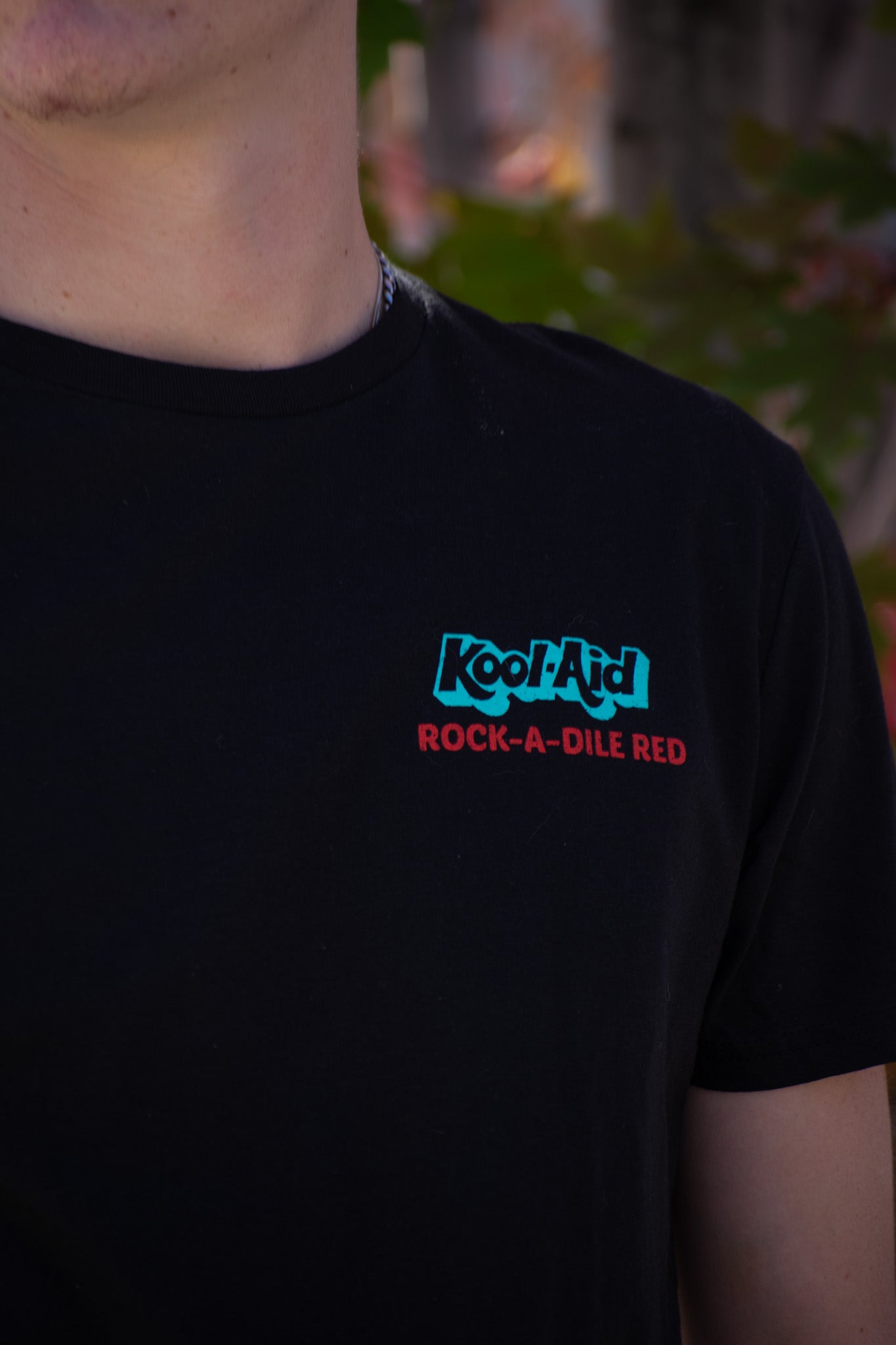 Black shirt with a Kool Aid print on the back