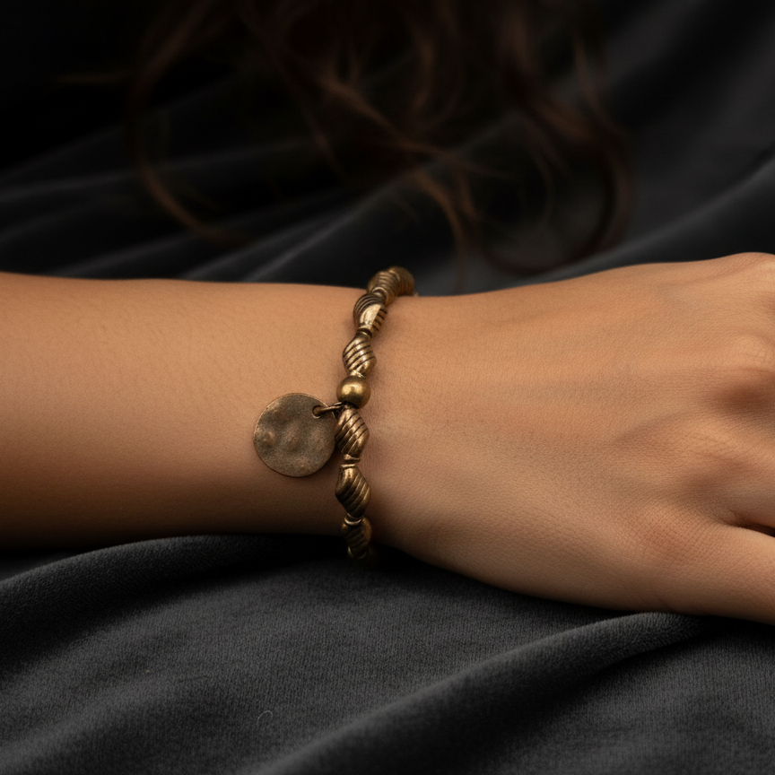 Bronze Colored Beaded Bracelet Featuring a Single Circle Charm