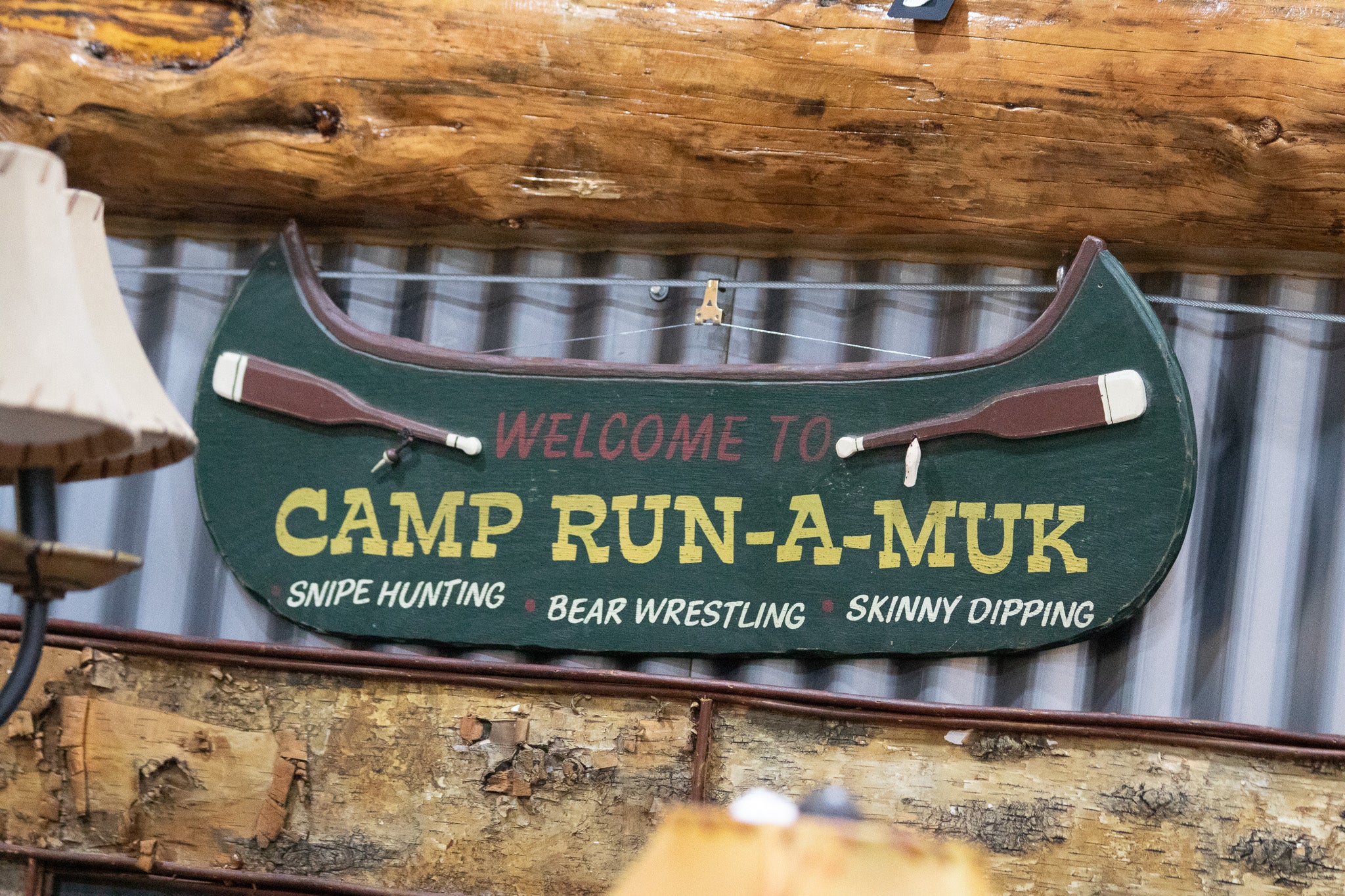 Wooden Green Painted Canoe "Welcome to Camp Run-Muk" Wooden Sign