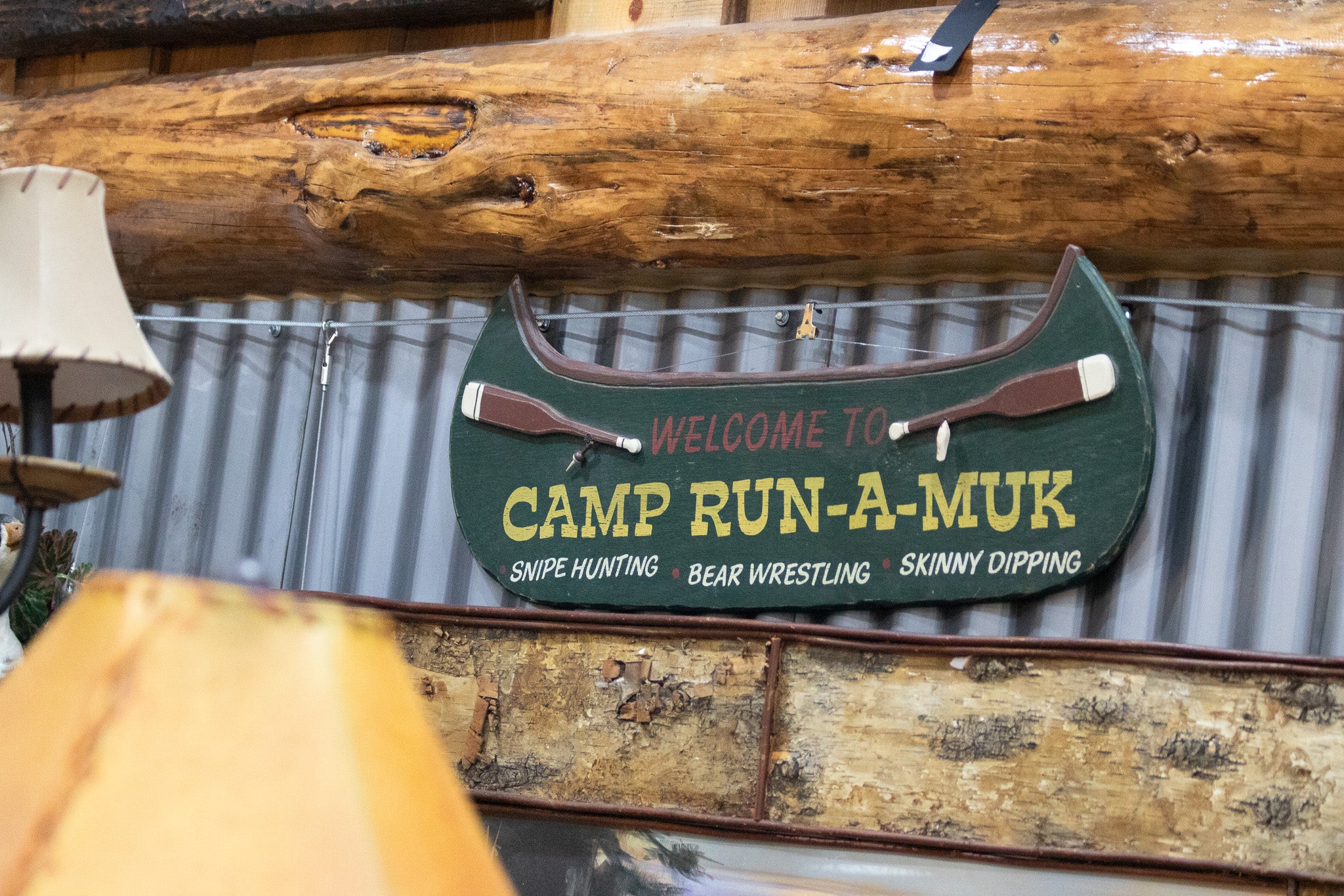 Wooden Green Painted Canoe "Welcome to Camp Run-Muk" Wooden Sign