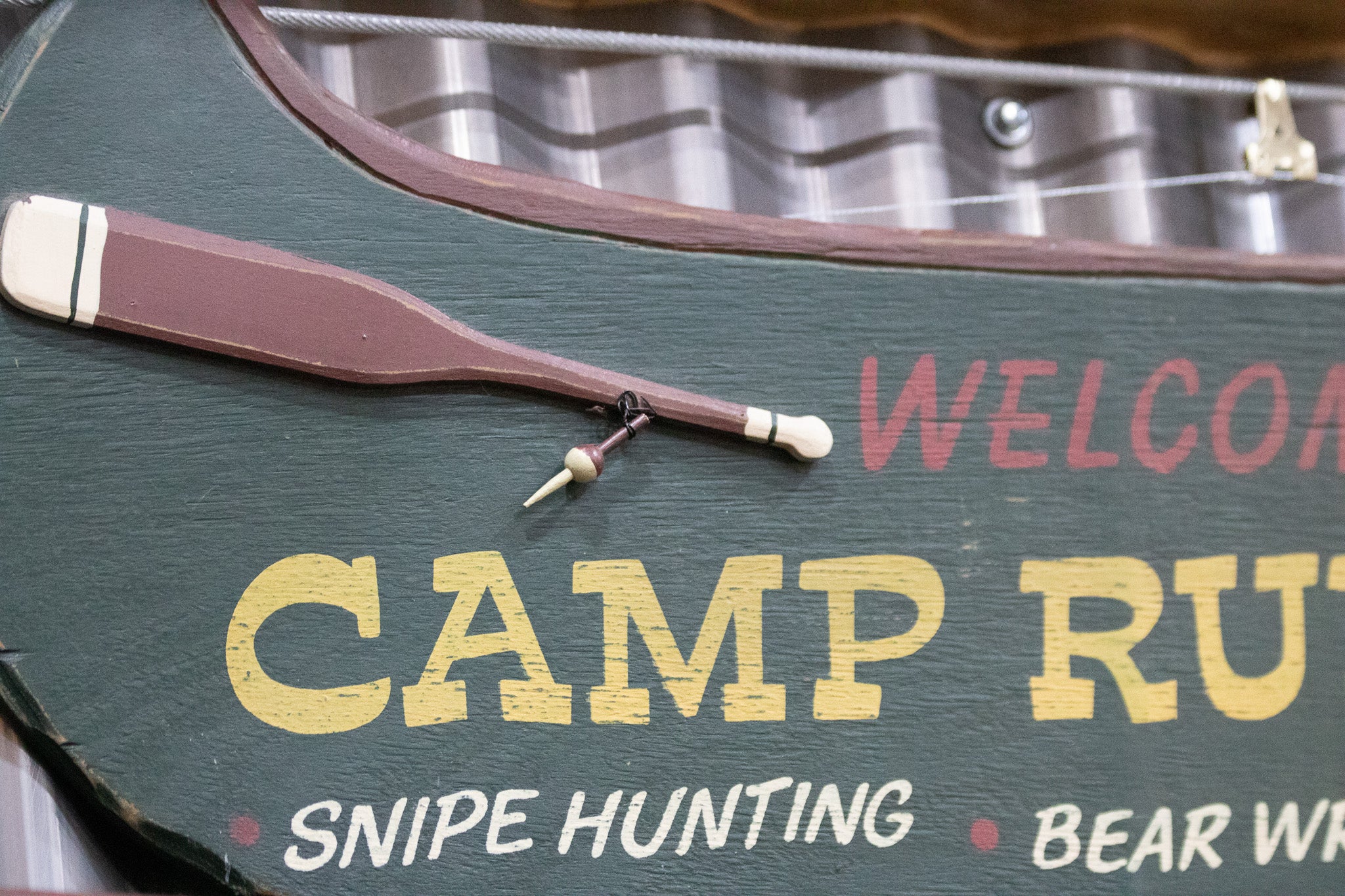 Wooden Green Painted Canoe "Welcome to Camp Run-Muk" Wooden Sign