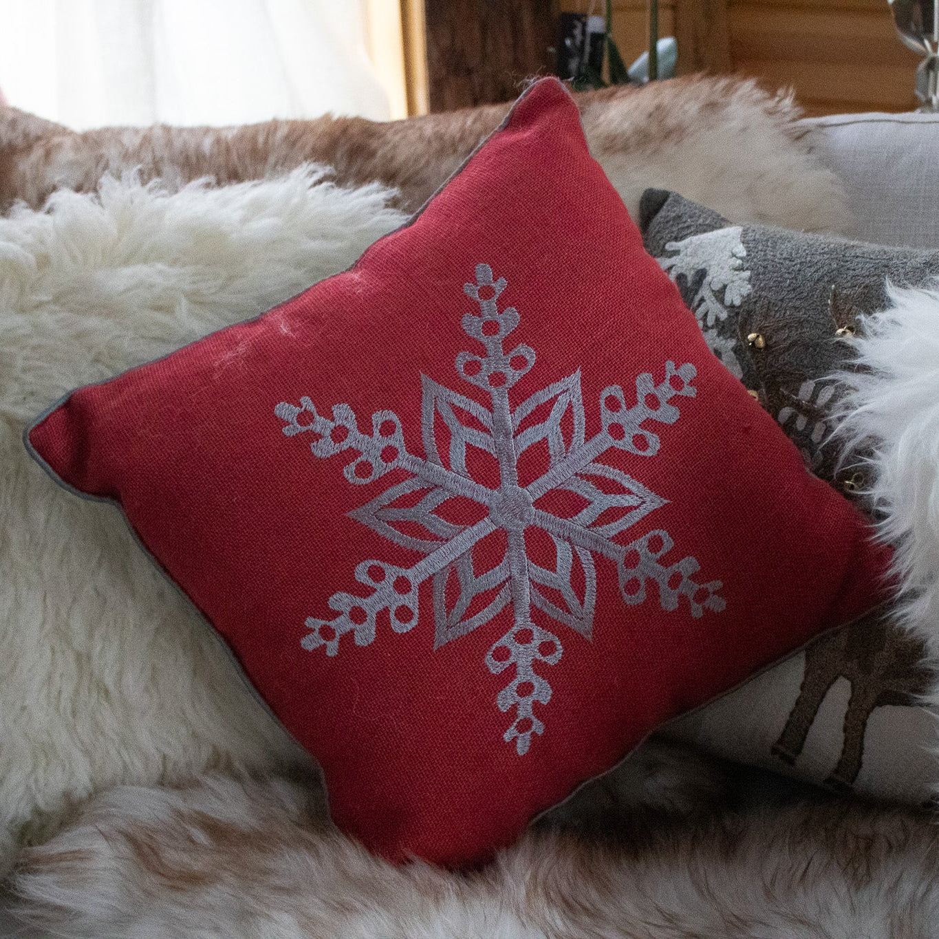 Red Cozy Throw Pillow with Elegant Snowflake Pattern