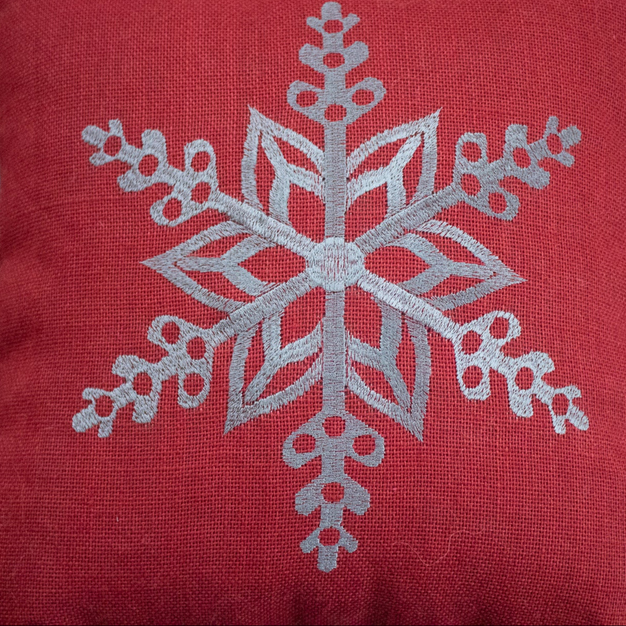 Red Cozy Throw Pillow with Elegant Snowflake Pattern