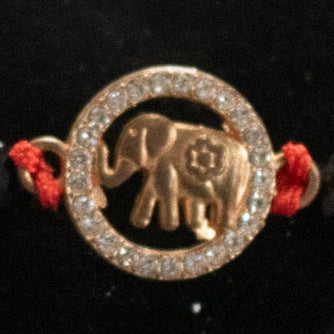 Red Braided Jute Cord Bracelet with Gold Colored Zirconia Elephant Charm
