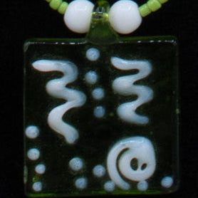 A Green Glass Pendent Adorned on a Dainty Green Beaded Necklace