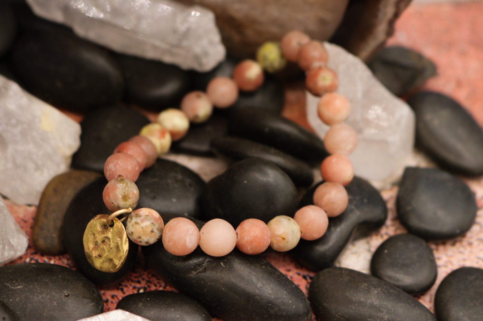 Natural Pink Stone Elastic Bracelet Featuring a Gold Charm