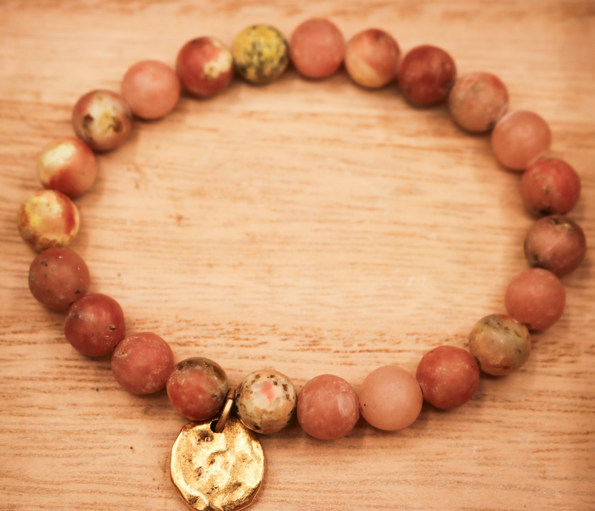 Natural Pink Stone Elastic Bracelet Featuring a Gold Charm
