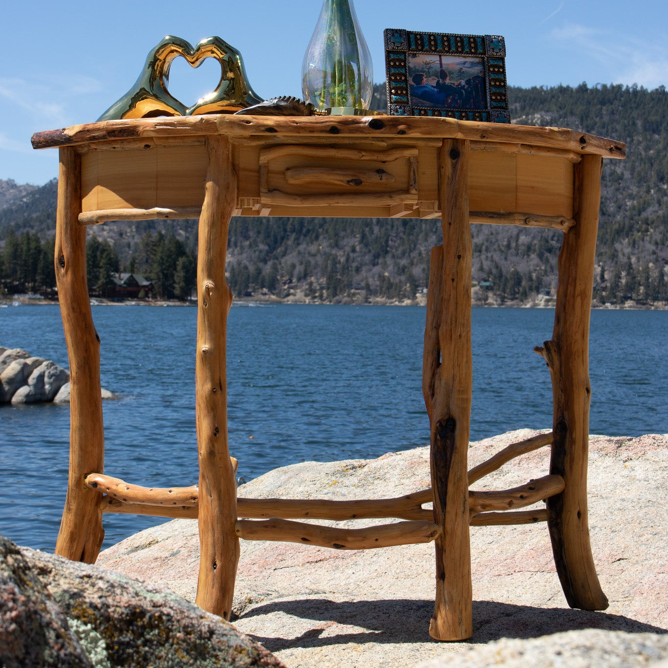 A semi-circle natural wood side table 