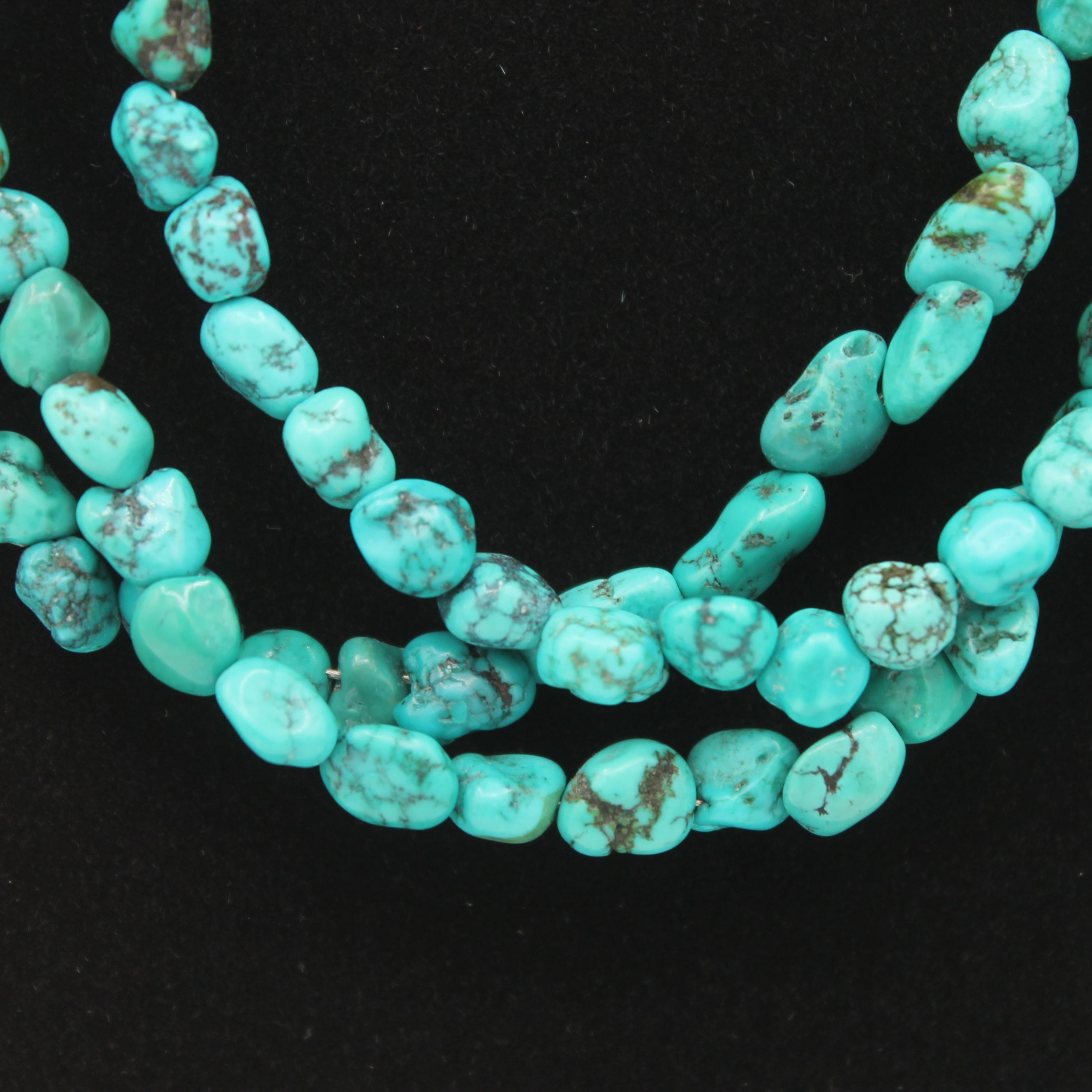Vintage Navajo Turquoise Nugget Triple Strand Necklace with a Sterling Silver Toggle Clasp.