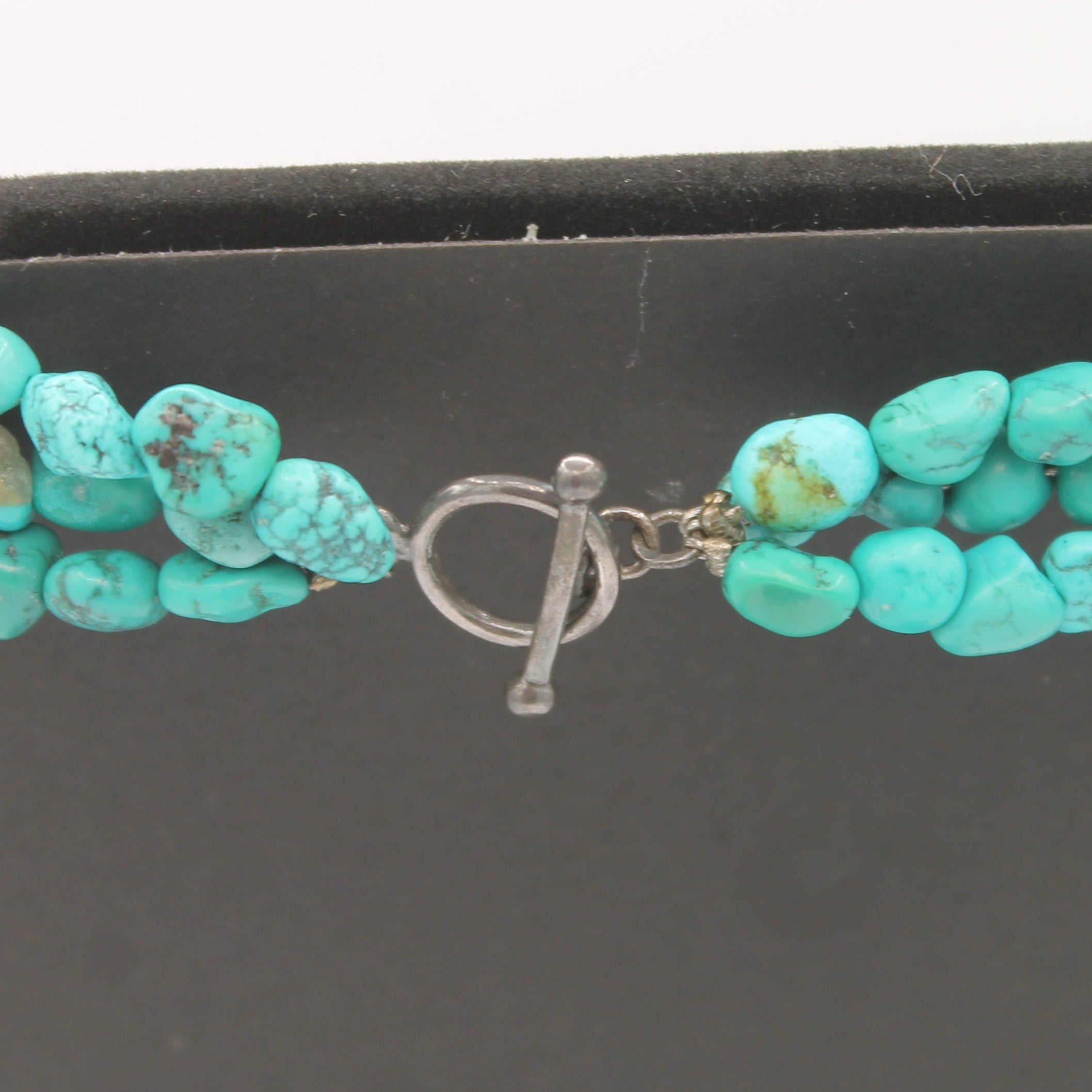 Vintage Navajo Turquoise Nugget Triple Strand Necklace with a Sterling Silver Toggle Clasp.