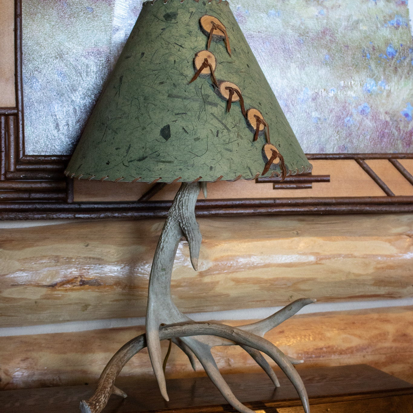 Classic Elk Horn Lamp Complemented by a Green Patterned Shade