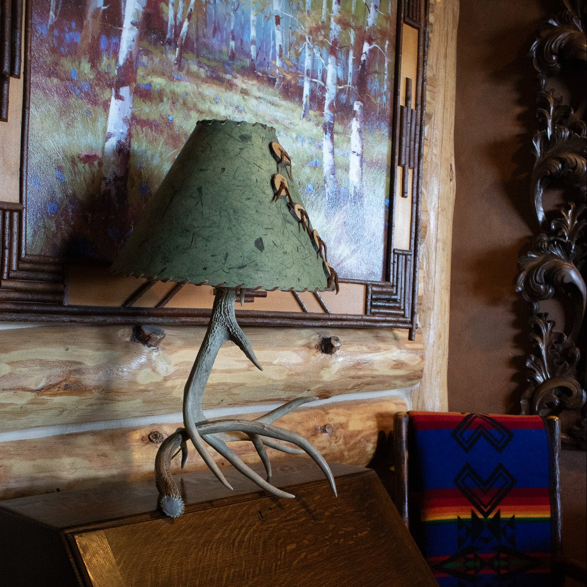 Classic Elk Horn Lamp Complemented by a Green Patterned Shade