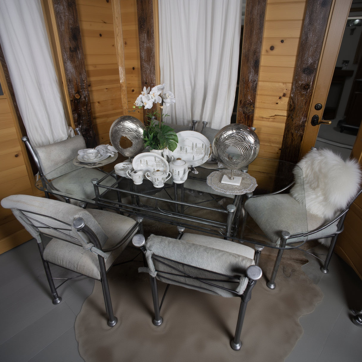 Vintage Raw Metal Table with Glass Tabletop and Six Chairs with Cowhide Cushions (From the Kreiss Collection) Restyled 90s Piece