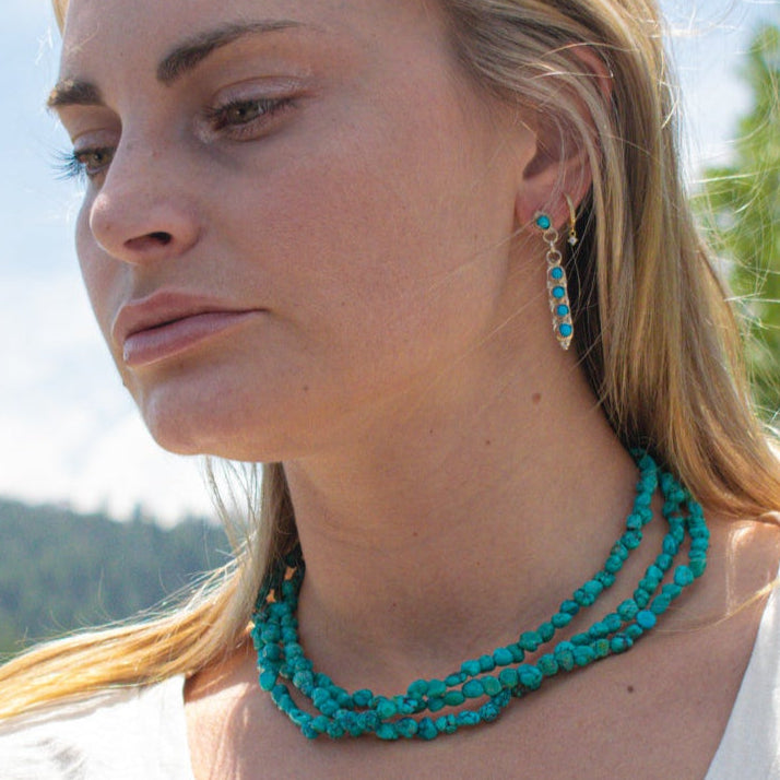 Vintage Navajo Turquoise Nugget Triple Strand Necklace with a Sterling Silver Toggle Clasp.