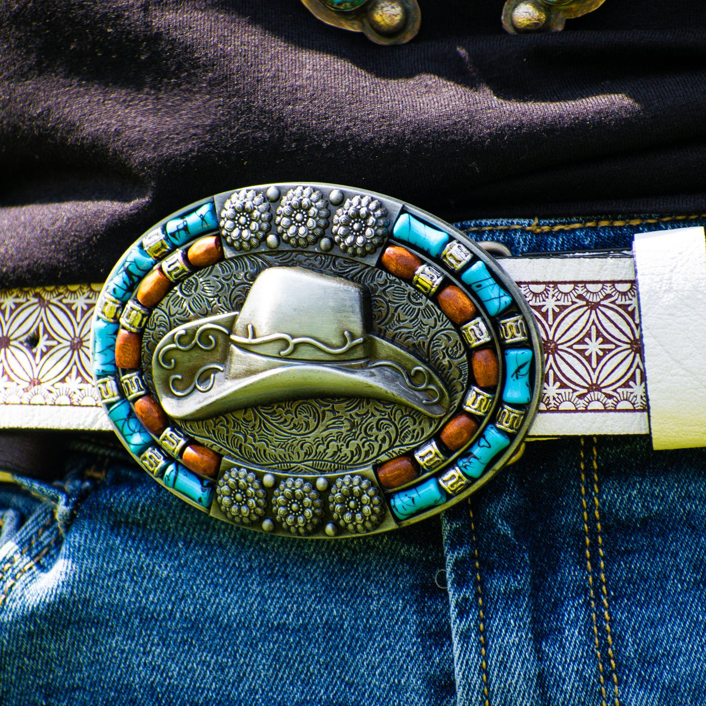 Western Cowboy Hat-themed Belt Buckle on a Engraved White Leather Belt Band