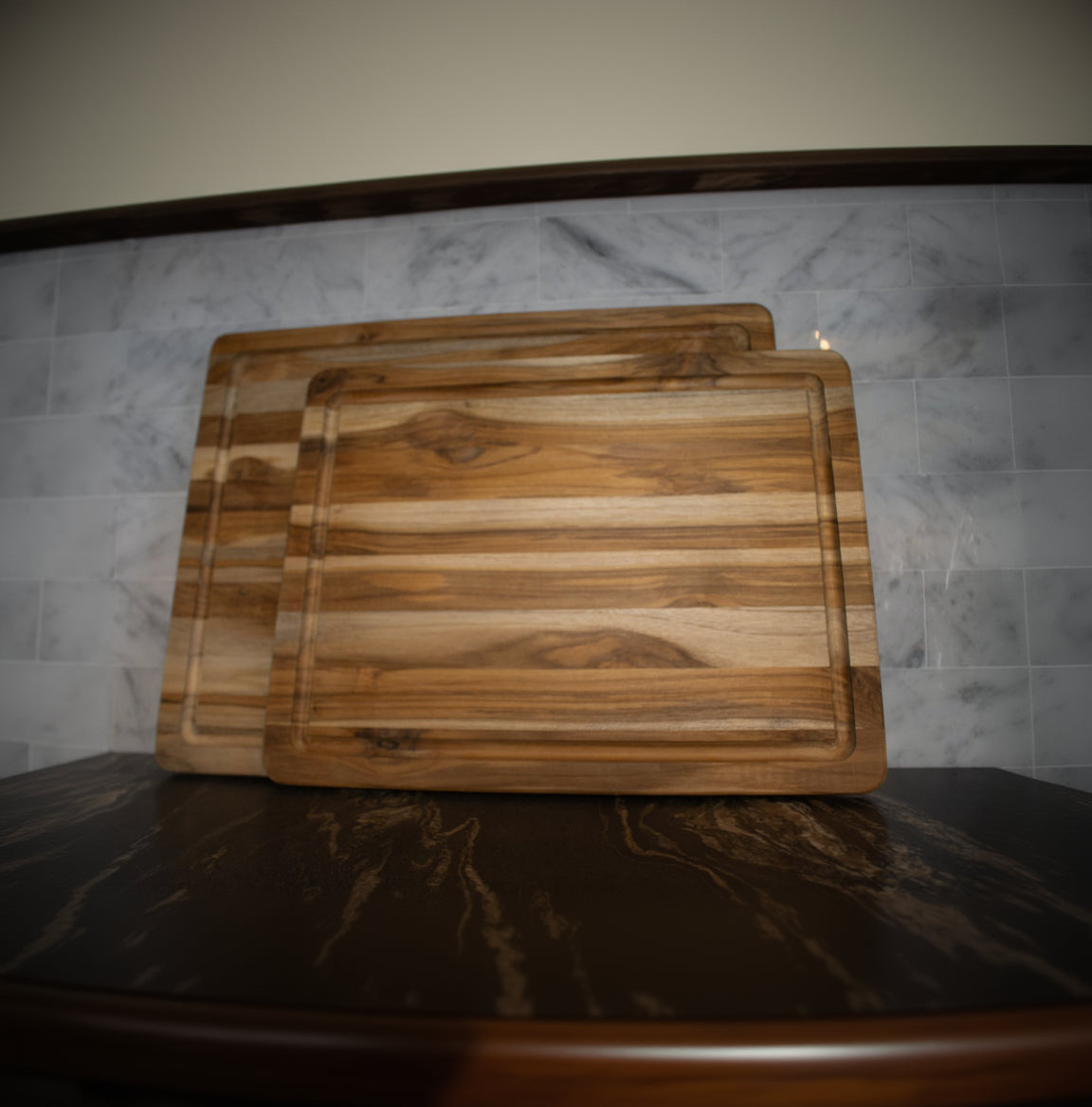 large rectangular wooden cutting board with natural wood grain finish and ribbed juice groove available in two sizes
