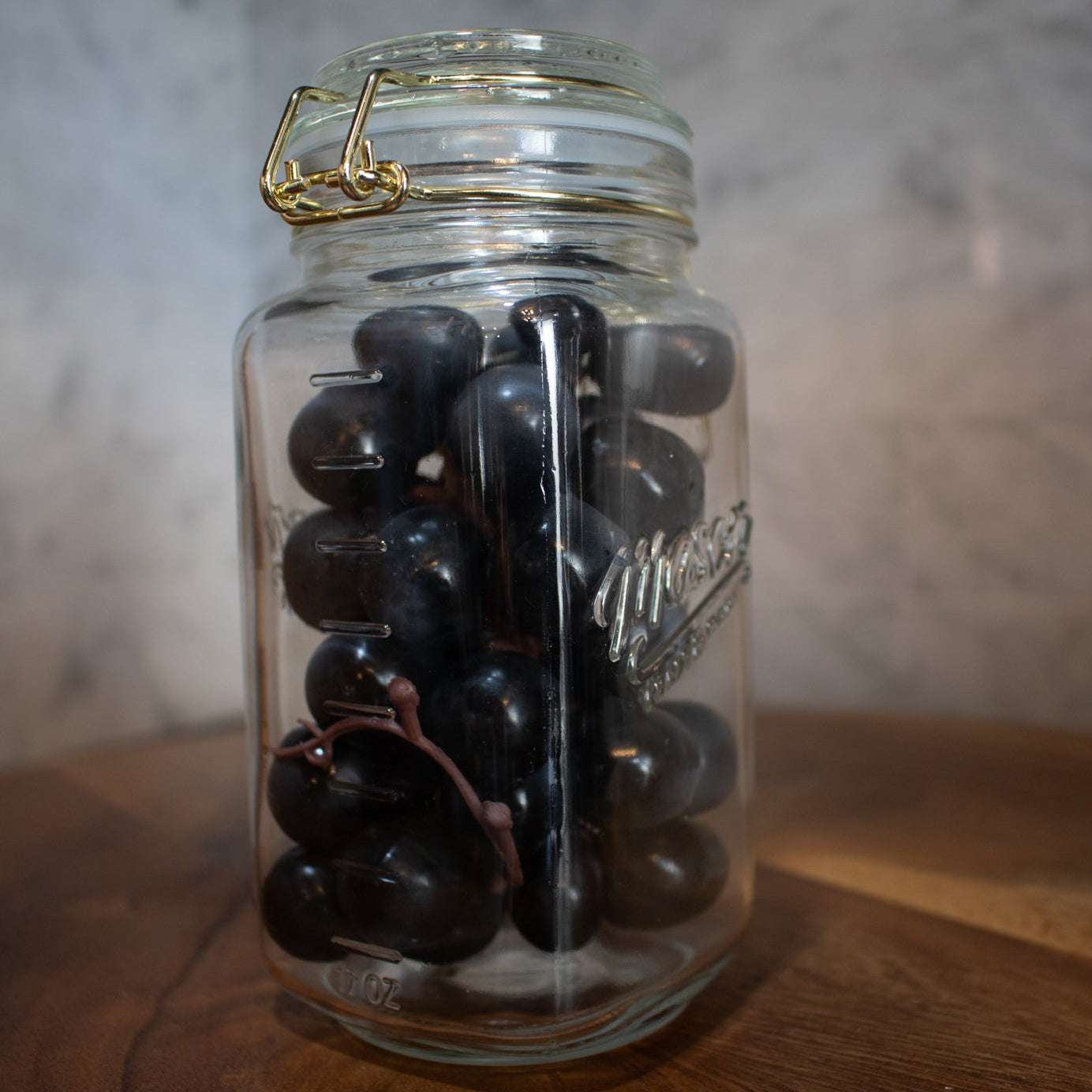 Mason Jar with gold clamp on lid