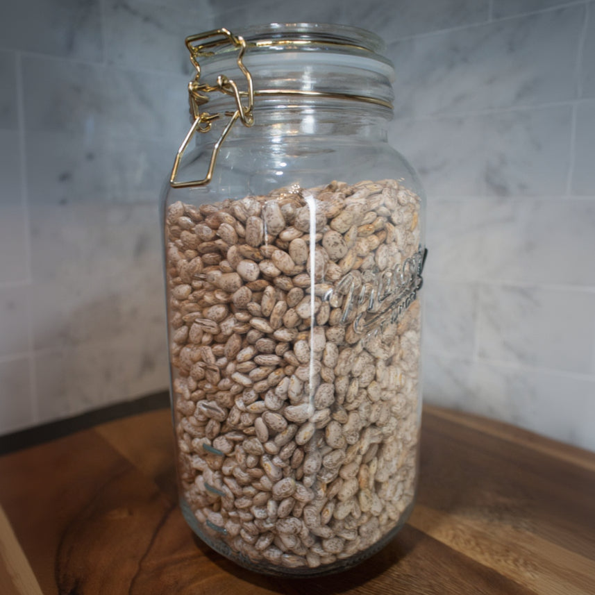 Mason Jar with gold clamp on lid