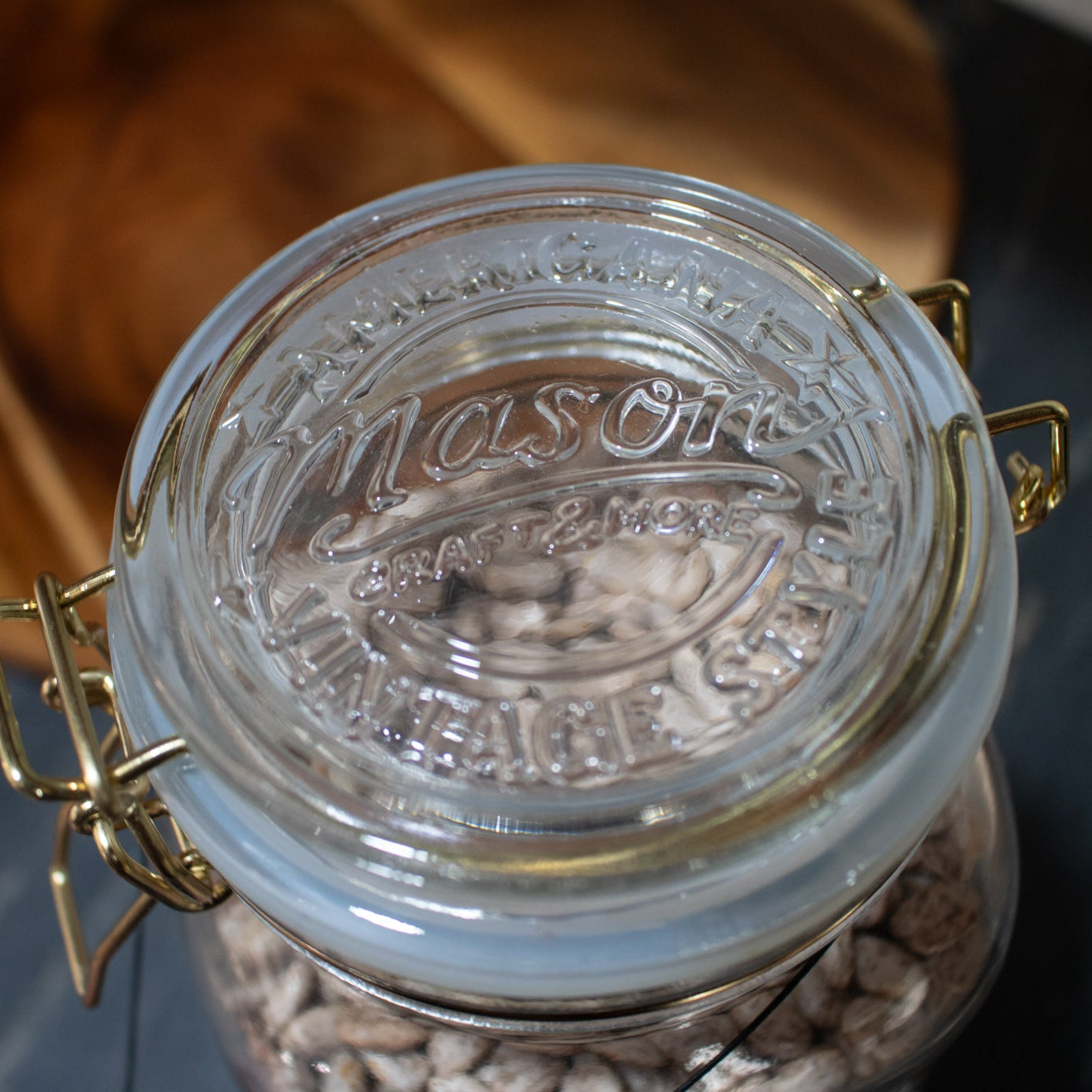 Mason Jar with gold clamp on lid
