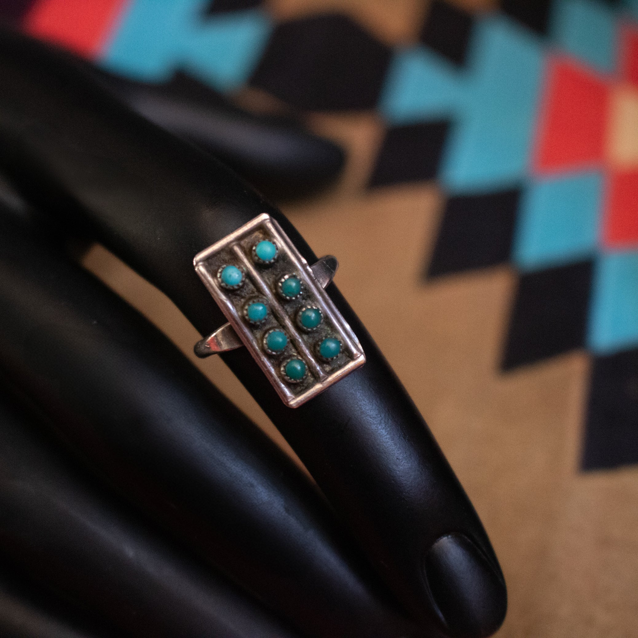 Eight Mini Turquoise Gemstones Aligned in Rows Along a thin Sterling Silver Ring Size 7