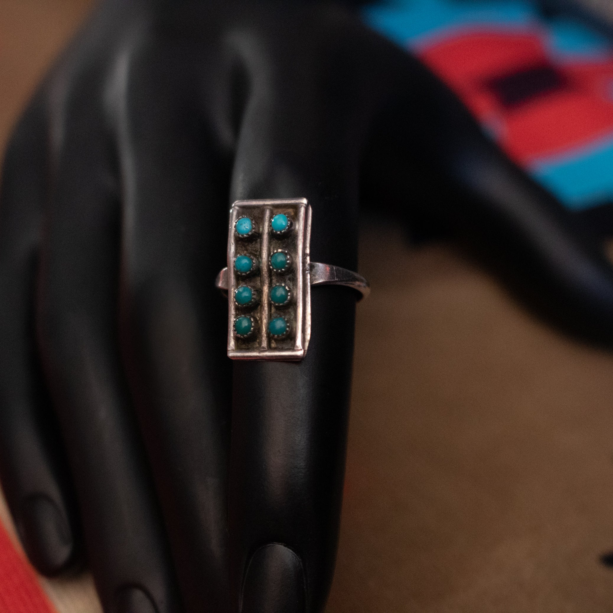 Eight Mini Turquoise Gemstones Aligned in Rows Along a thin Sterling Silver Ring Size 7