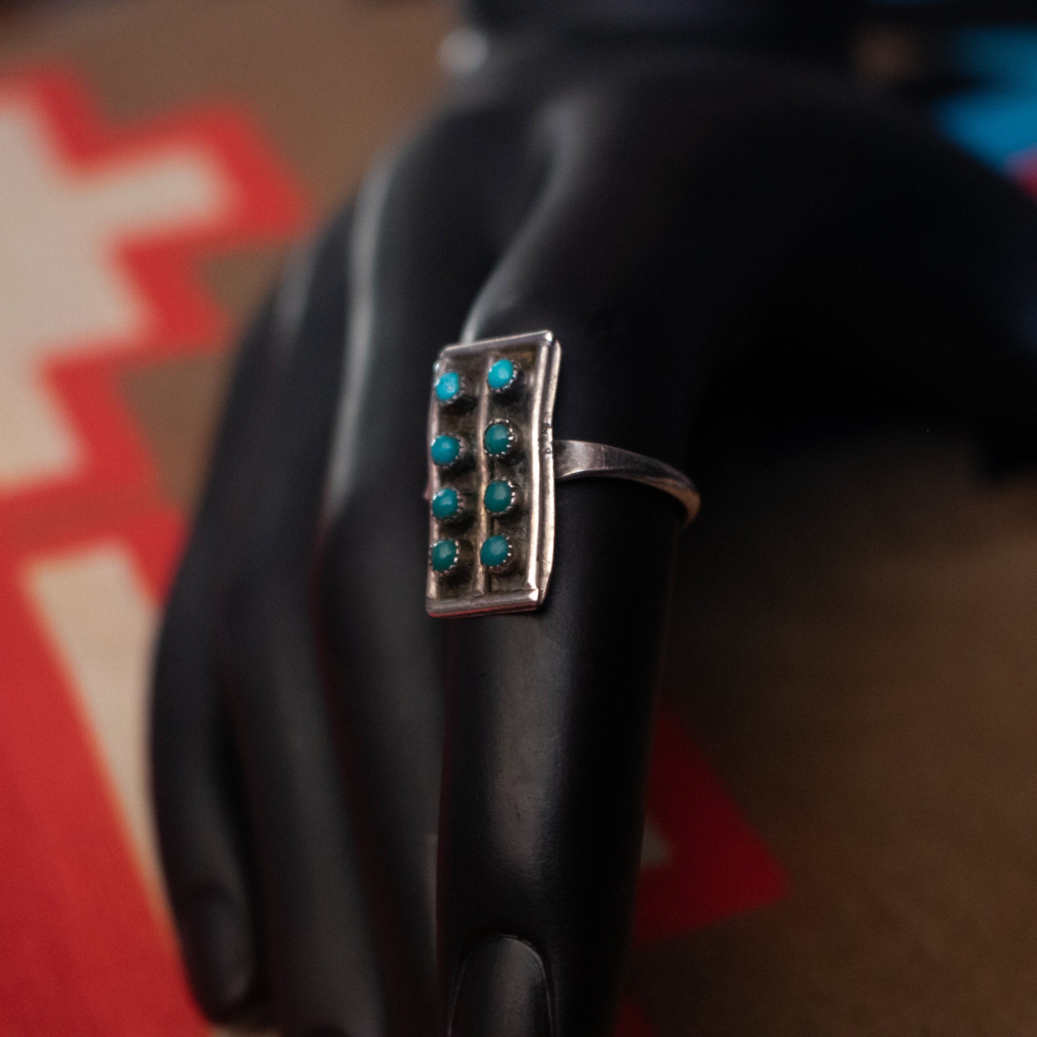 Eight Mini Turquoise Gemstones Aligned in Rows Along a thin Sterling Silver Ring Size 7