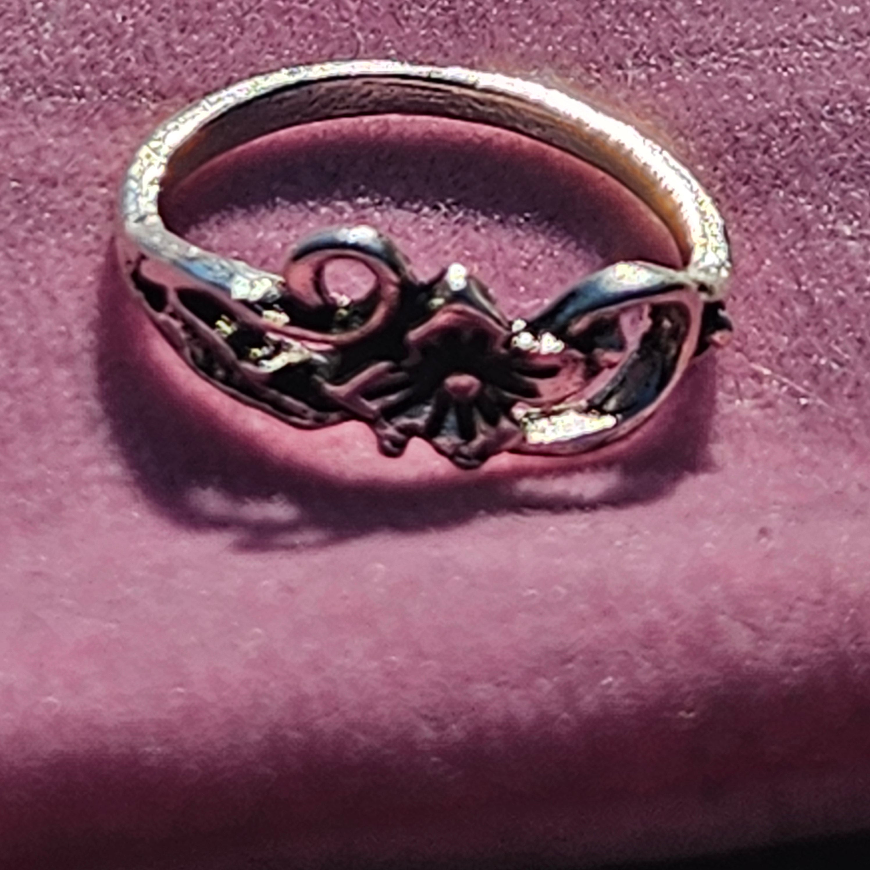 Vintage silver plated floral ring featuring a lily flower centerpiece with ornate filigree scroll detailing, size 6.